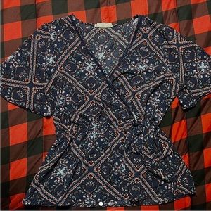 Purple blouse with flower detailing